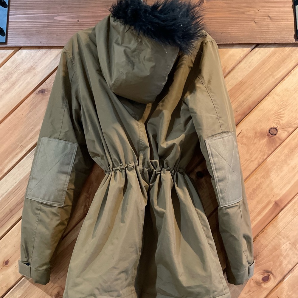 ASOS brown over the hip, black faux-fur trimmed hood. Insulated.